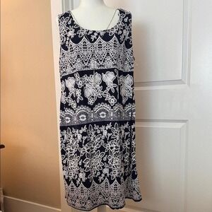 Black dress with white embroidered flowers in size 18 W.
